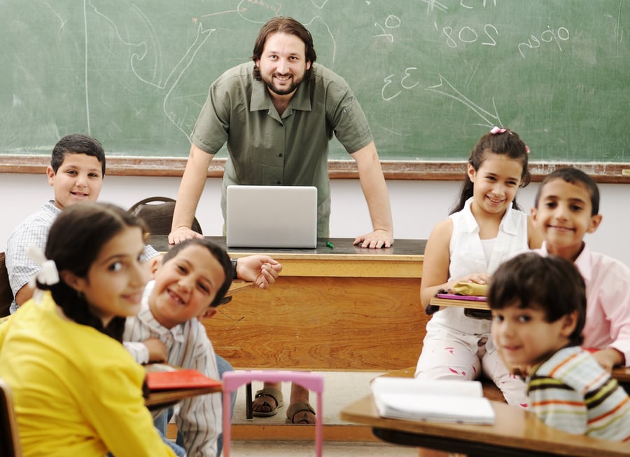 Interaction between male teacher and children, funny class in school